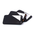 Three black slim wallets sleeves with a white card partially inserted, arranged in a fan shape on a clean white background. all-groups